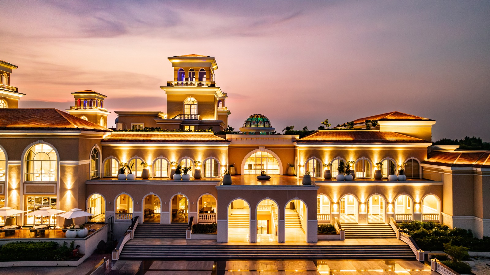 KBG Club terraces and illuminated architecture at dusk